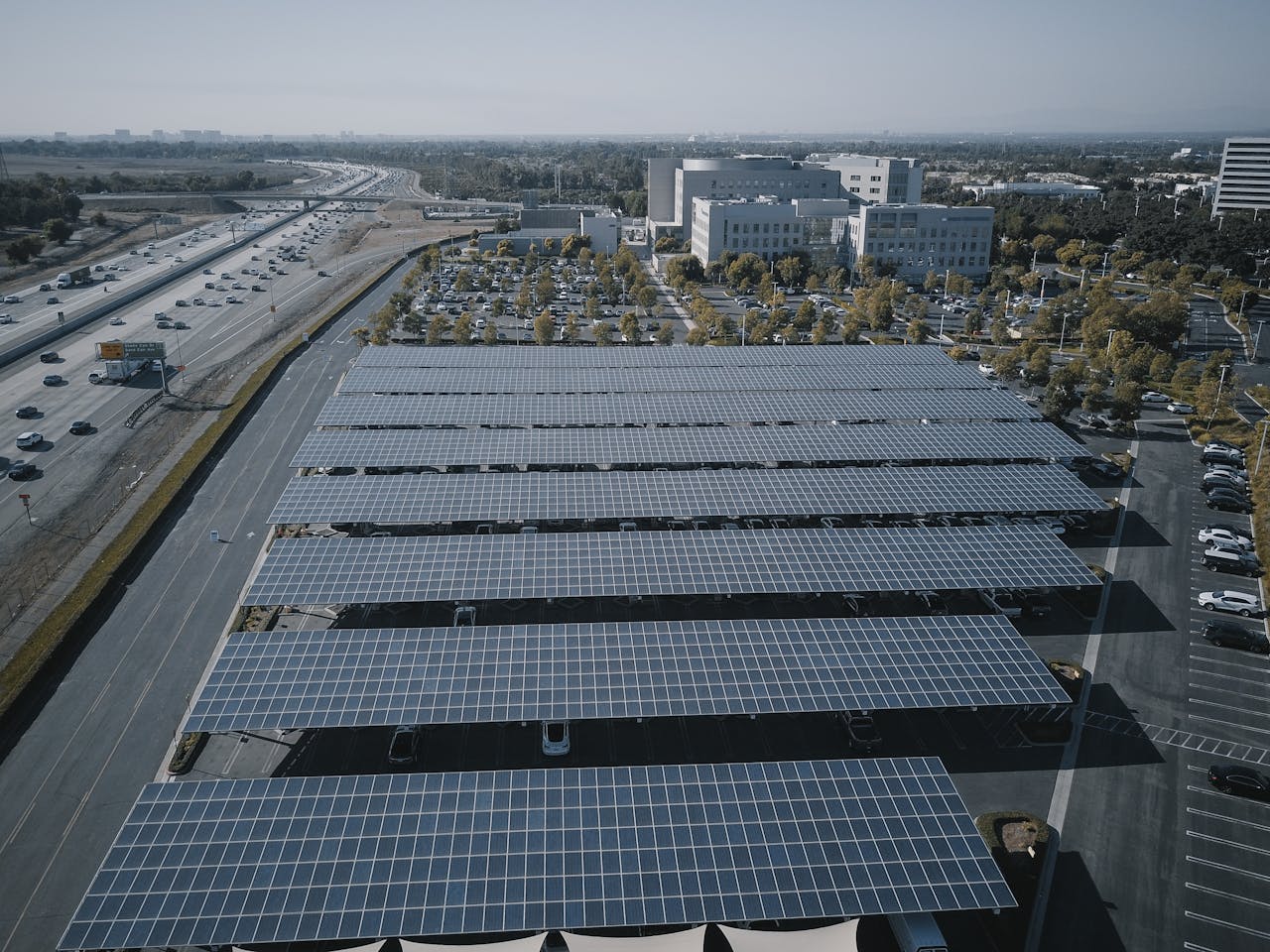About Aerial view of extensive solar panels in an urban setting, showcasing renewable energy.